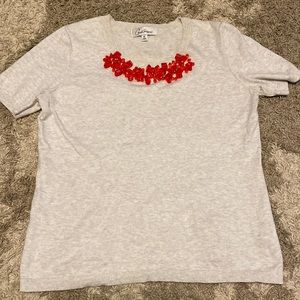 Shortsleeve knit shirt with jeweled neckline. CAbi brand, size Medium. $28